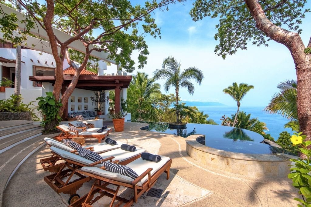Villa Ventanas al Mar sun loungers beside a round basin and curved pool — Puerto Vallarta, Mexico
