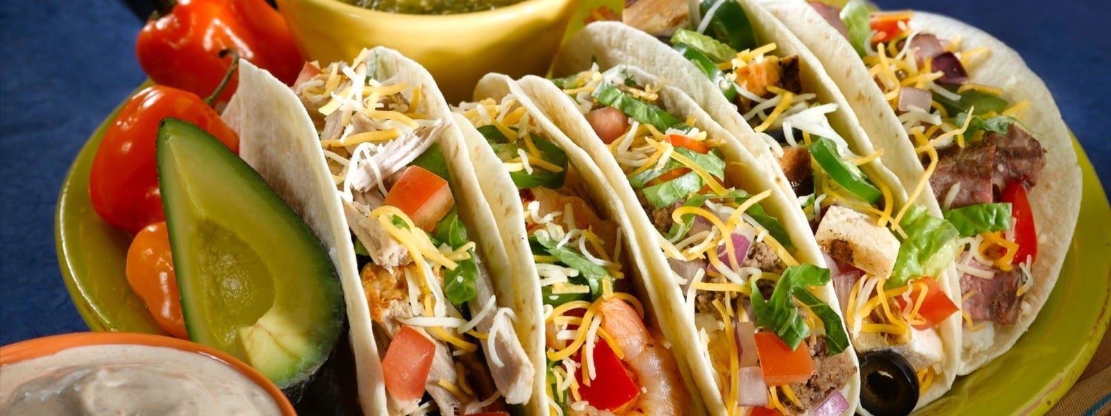 Authentic Mexican tacos with fresh toppings and avocado