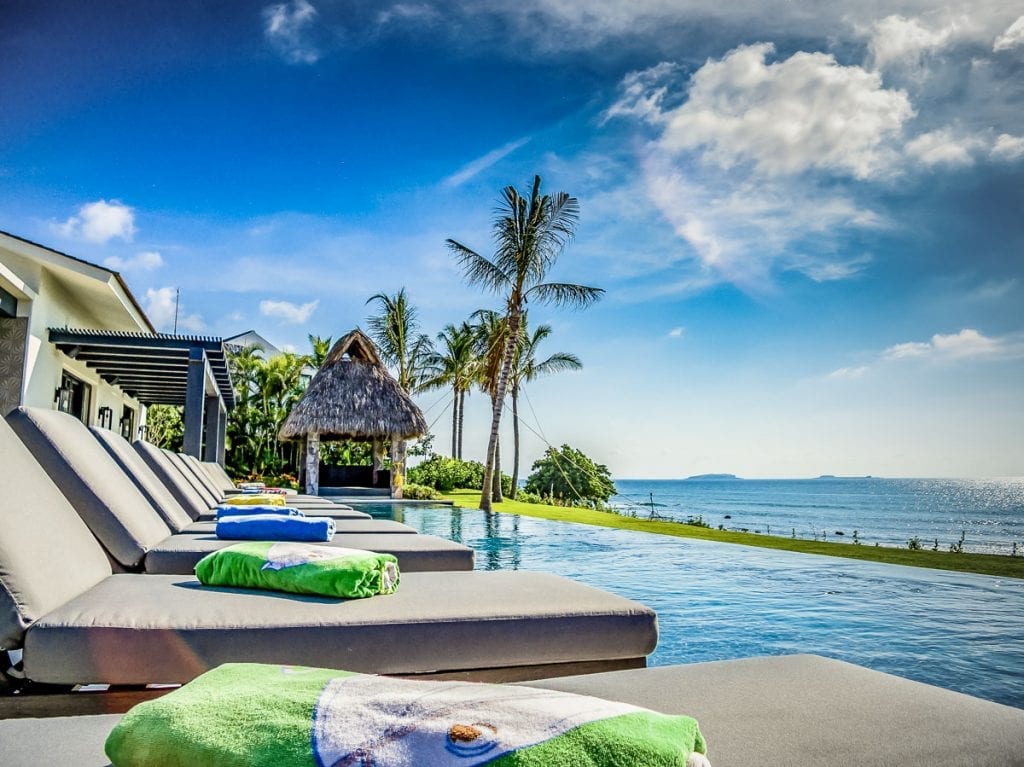 Villa Vatule poolside loungers with folded towels facing the ocean — Punta Mita Nayarit, Mexico