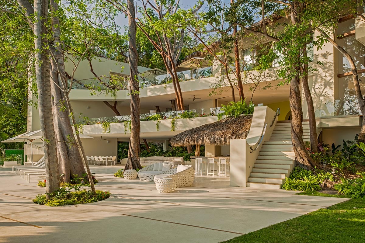 Casa Papelillos el Paredon exterior stairs winding through tall trees — Puerto Vallarta, Mexico