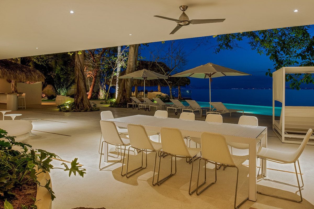 Casa Papelillos el Paredon set dining table overlooking the pool and bay — Puerto Vallarta, Mexico