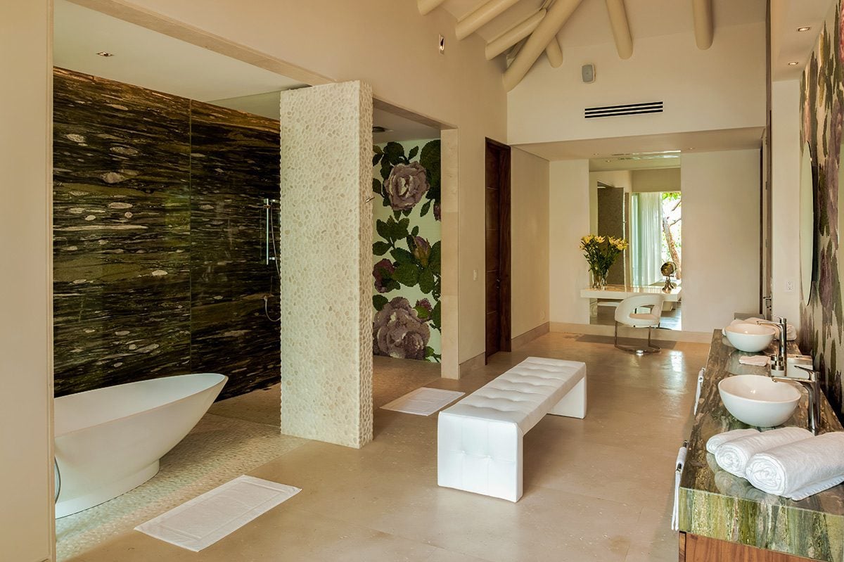 Casa Papelillos el Paredon bathroom with a white tub and dark wall — Puerto Vallarta, Mexico