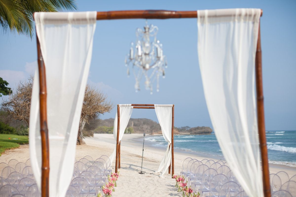 Wedding ceremony setup on the grassy knoll at Casa Tres Soles in Punta Mita with Pacific Ocean backdrop