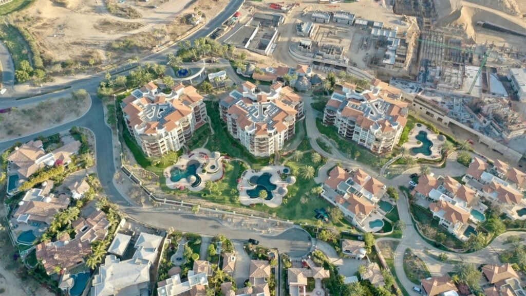 Casa de los Vientos aerial view over buildings, pools and surrounding roads — Los Cabos, Mexico