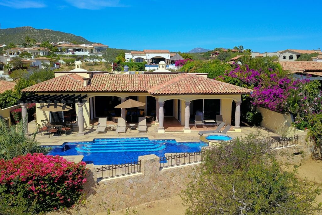 Villa Agave Azul elevated view of the pool and loggia below the mountains — Los Cabos, Mexico
