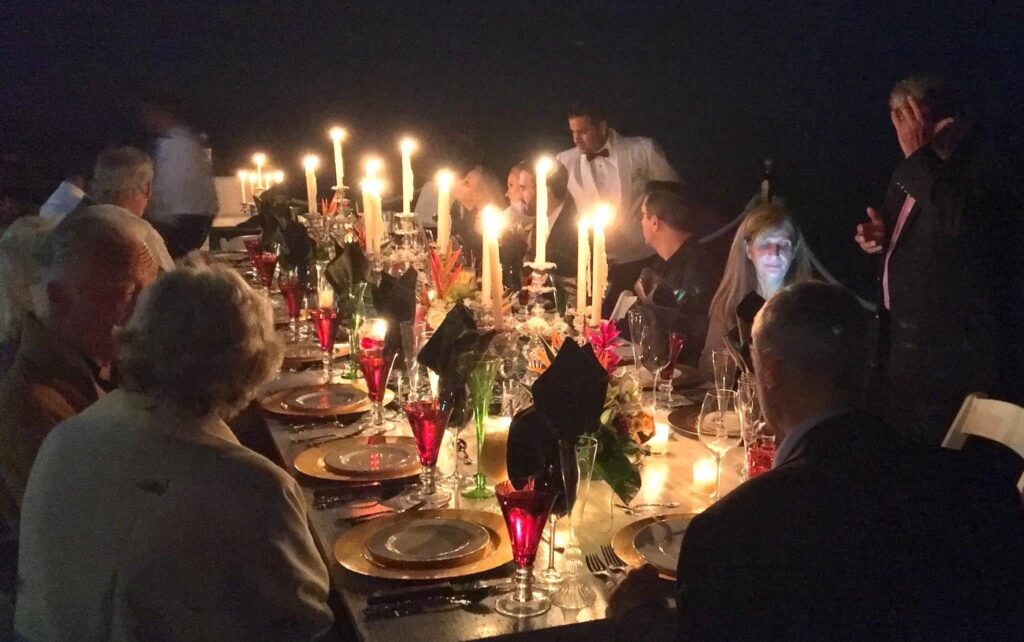 Group dining on the beach during Thanksgiving holidays.
