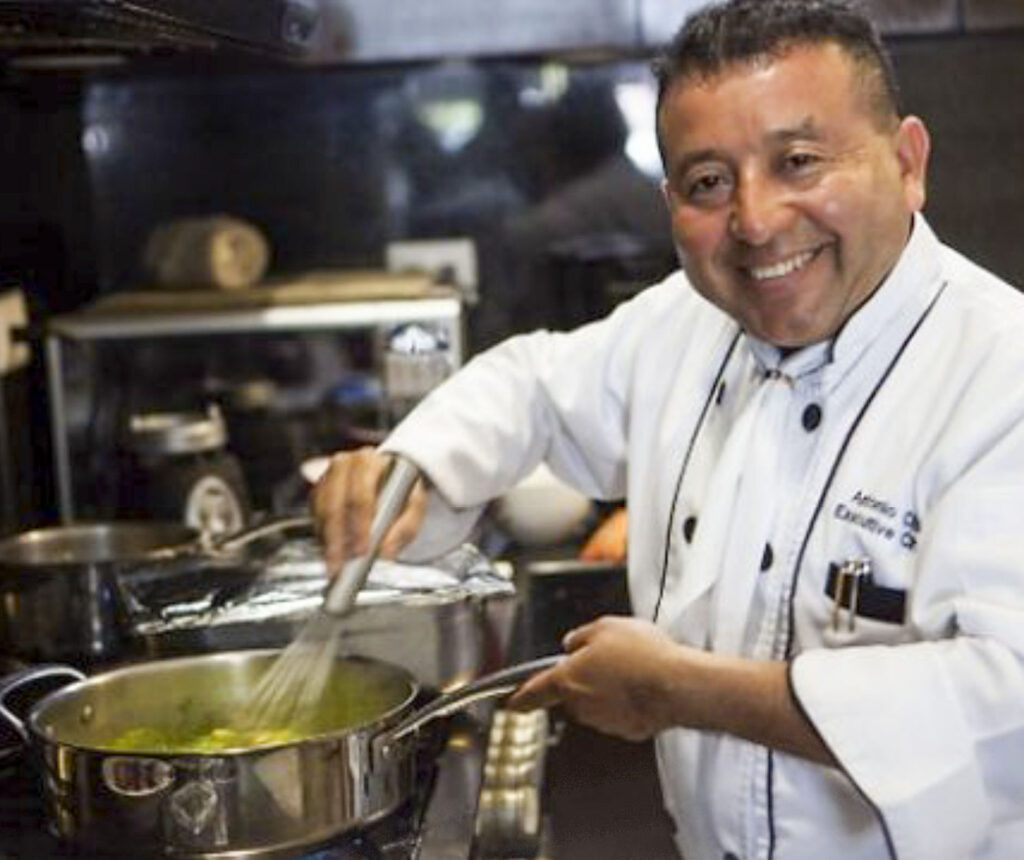 Smiling Personal Chef preparing a menu at a villa in Playa del Carmen