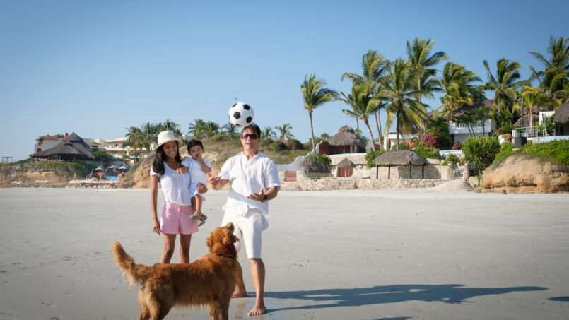 Family with their pet enjoying Mexico Vacation Rentals Pet-Friendly