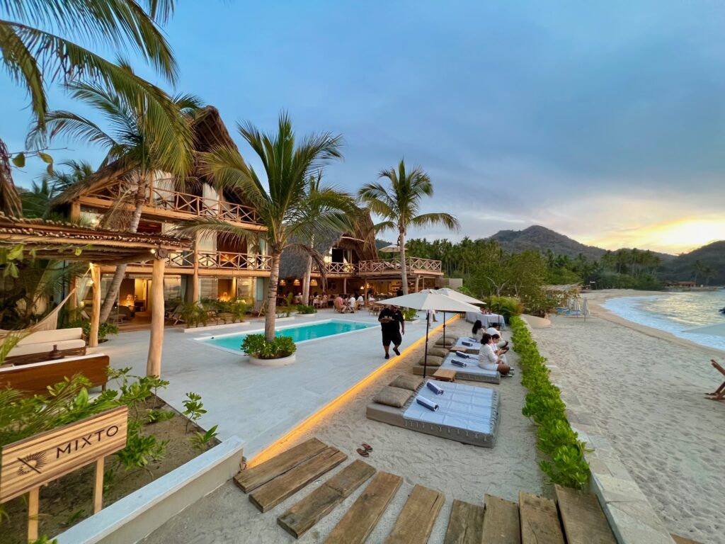 A panoramic evening view of Villa Mixto, a leading Puerto Vallarta event venue and wedding villa, set against the beautiful Quimixto Beach.