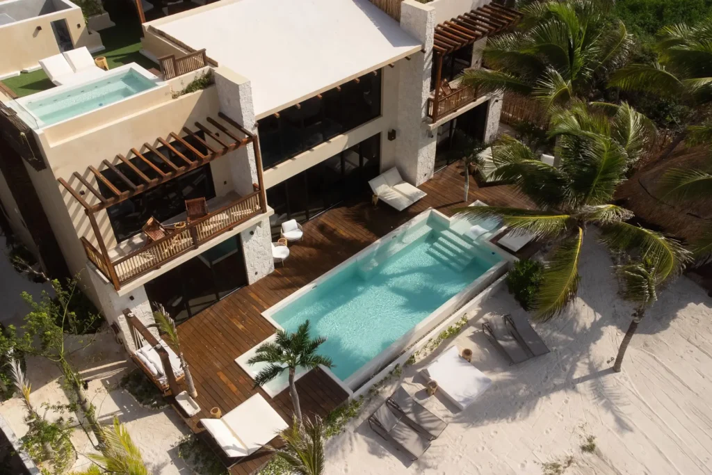 Villa Tulumar aerial view of two pools and the wood sun deck — Tulum, Mexico