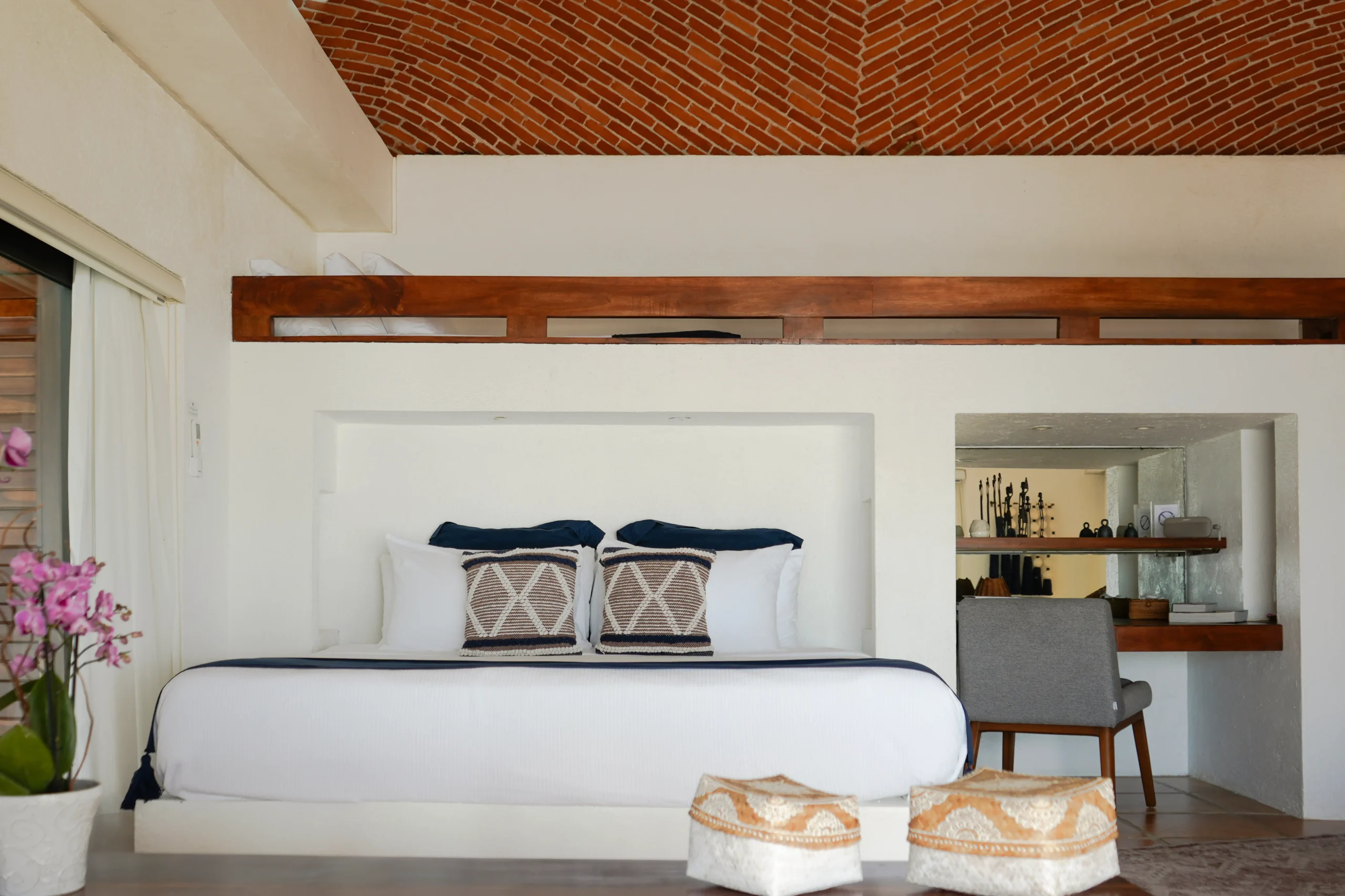 Casa Corazon bedroom with brick vaulted ceiling and woven ottomans — Playa del Carmen, Mexico