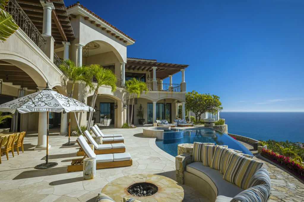Villa Mar Azul fire pit lounge and loungers beside the infinity pool — Los Cabos, Mexico