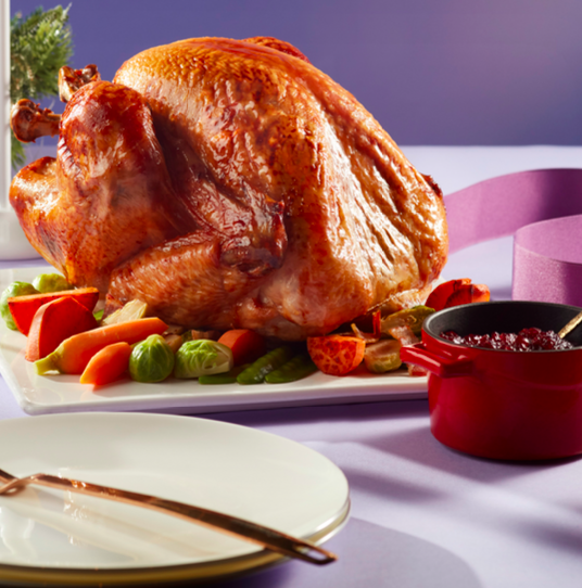 Thanksgiving dinner table with a roasted turkey and festive decorations in Punta Mita, Mexico