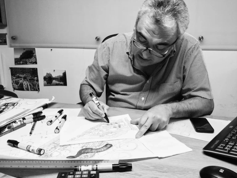 Architect Jaime Barba working on architectural designs for luxury villas.