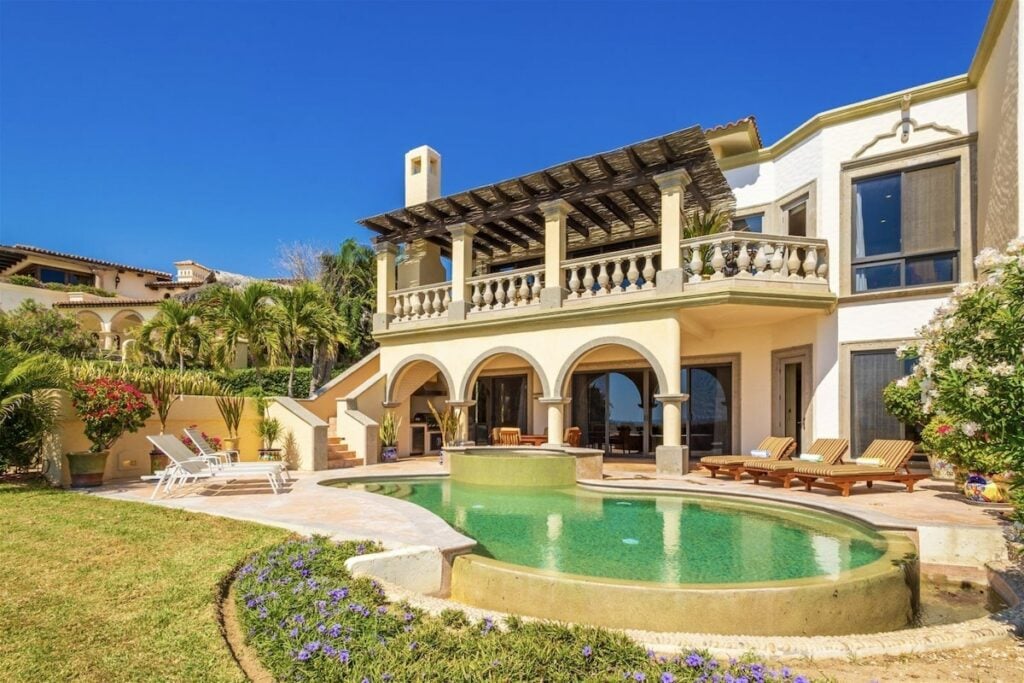 Villa Mariposa the two-storey rear elevation above the green-tiled pool — Los Cabos, Mexico