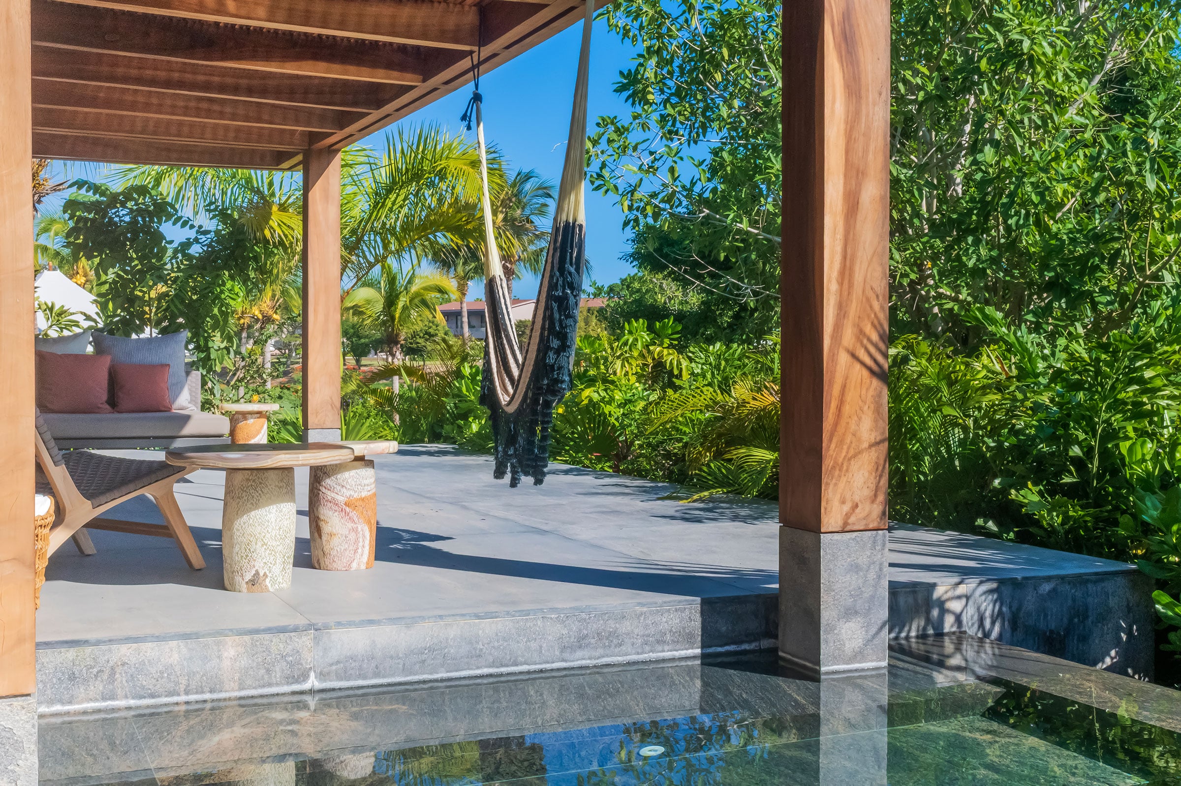 Casa Balena a hammock slung under the timber roof beside the plunge pool — Punta Mita, Mexico