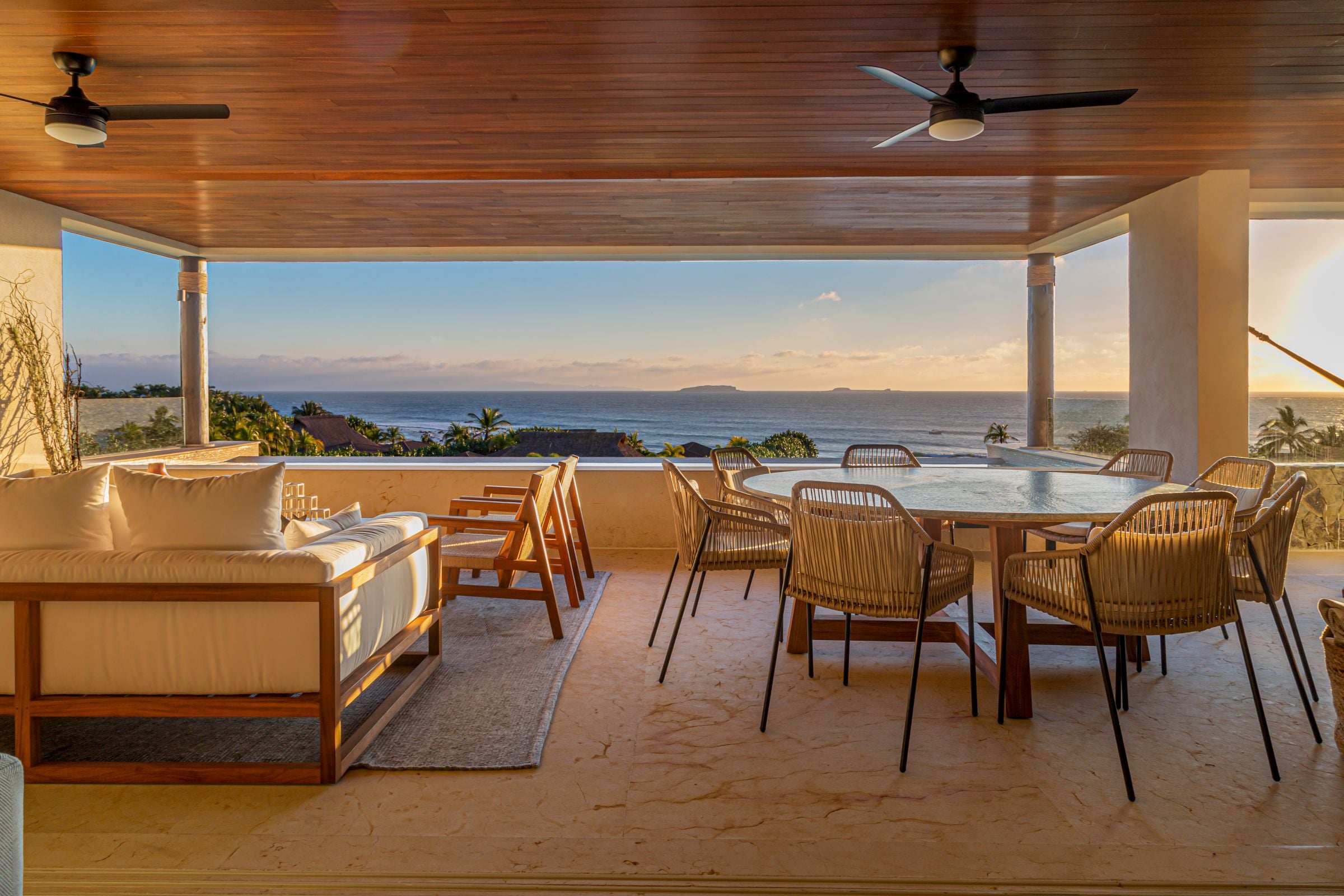 Condo Haramara the round terrace table and sofa under the timber ceiling — Punta Mita, Mexico