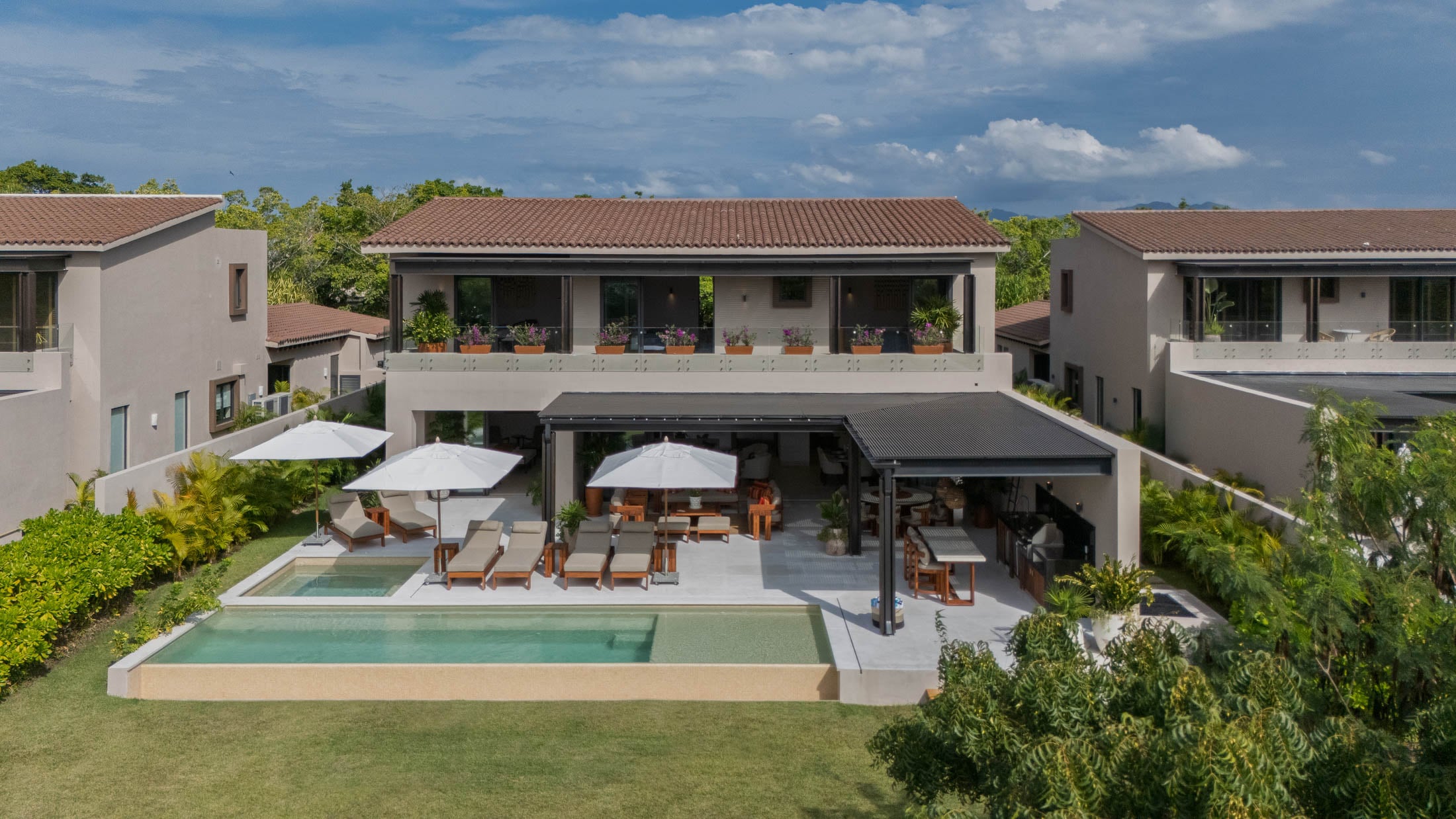 Villa Amada the rear elevation and pool seen from above the lawn — Punta Mita, Mexico
