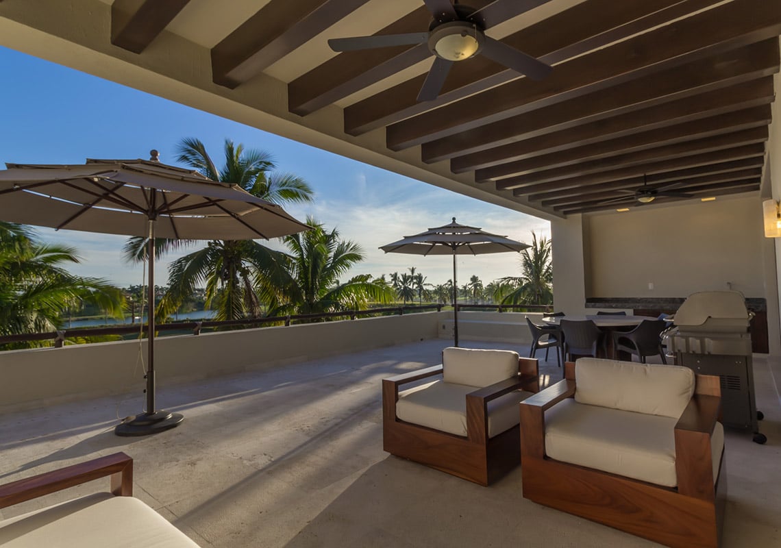 Condo Terrazas B32 umbrellas, armchairs and a grill on the beamed terrace — Punta Mita, Mexico