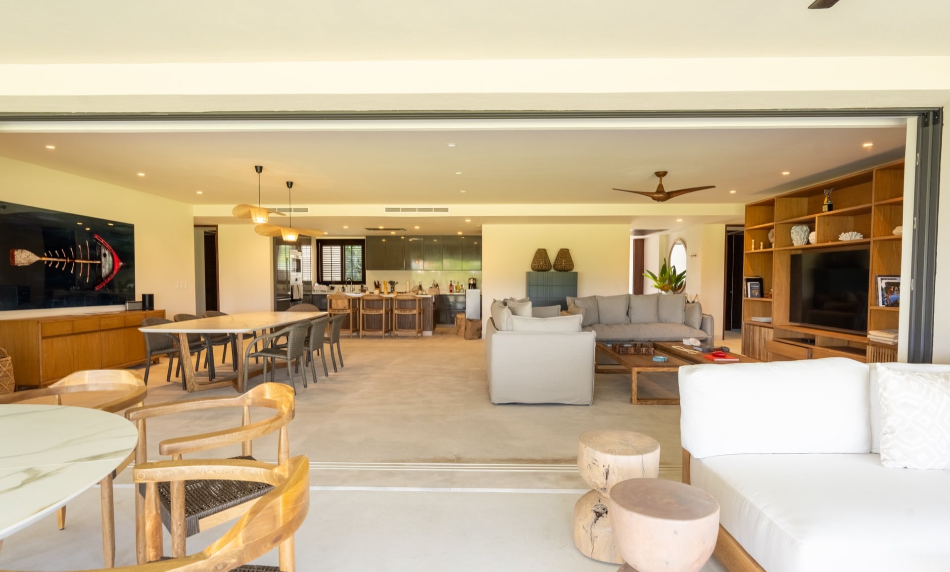 Condo El Encanto 401 open living and dining room with the kitchen beyond — Punta Mita Nayarit, Mexico