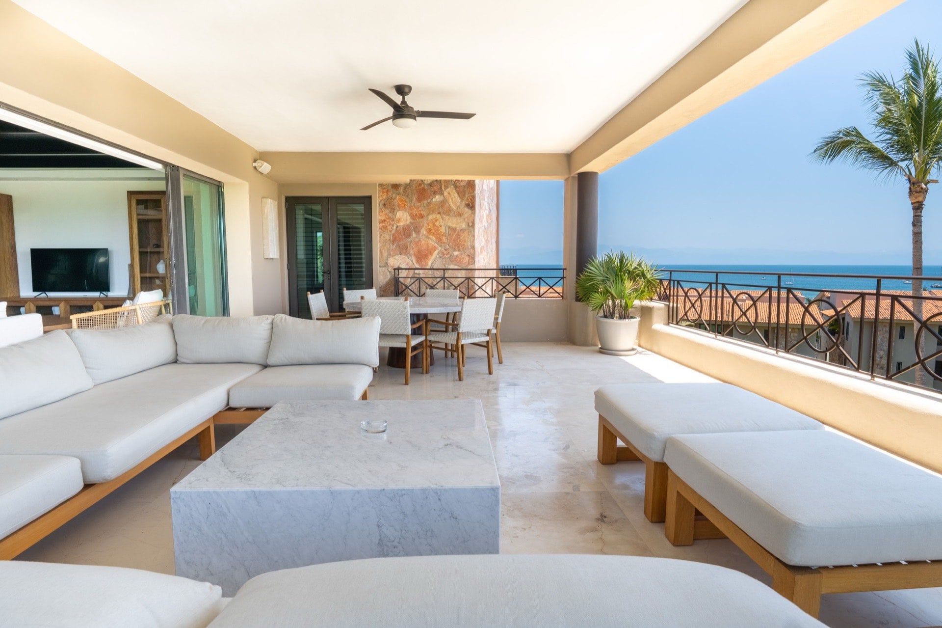 Condo Hacienda de Mita 705 covered terrace with sectional, chaise lounges, and dining set — Punta Mita Nayarit, Mexico