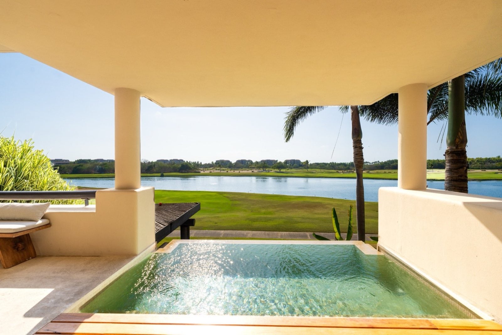 Condo El Encanto 602 covered terrace pool overlooking a lagoon and lawn — Punta Mita Nayarit, Mexico
