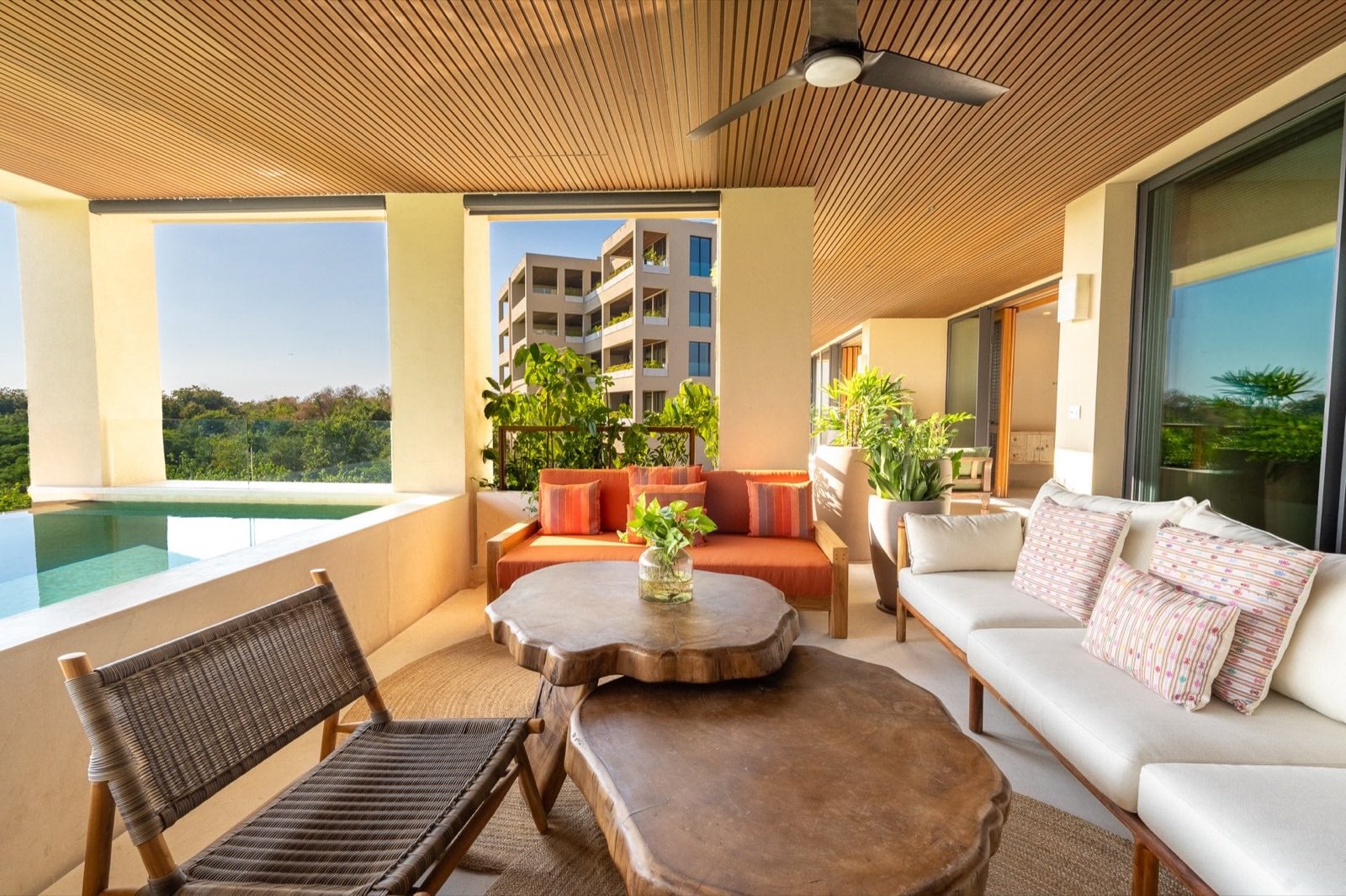 Surf Residences 211 covered terrace with a round table, sofa and lounge chairs — Punta Mita Nayarit, Mexico
