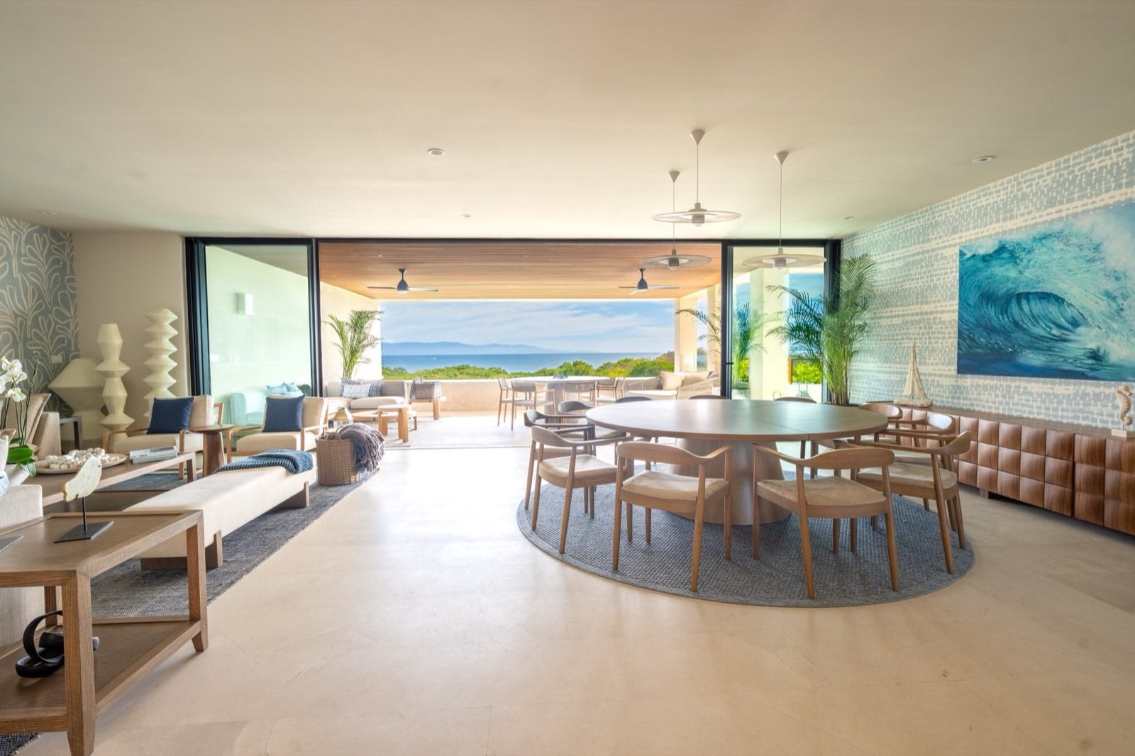 Surf Residences 221 open living and dining room with a round table and terrace view — Punta Mita Nayarit, Mexico