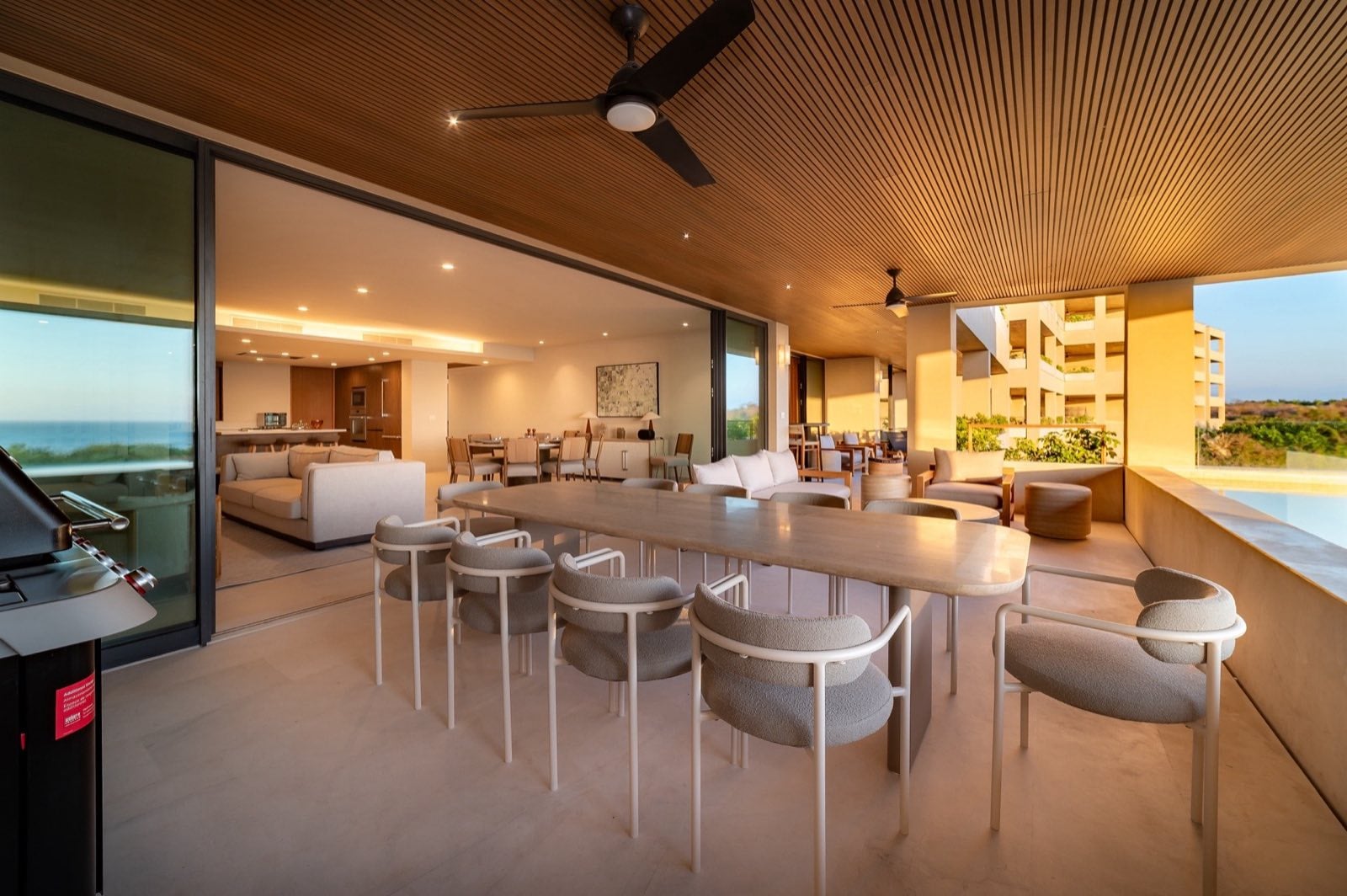 Surf Residences 312 covered terrace dining table beside the pool and living area — Punta Mita Nayarit, Mexico