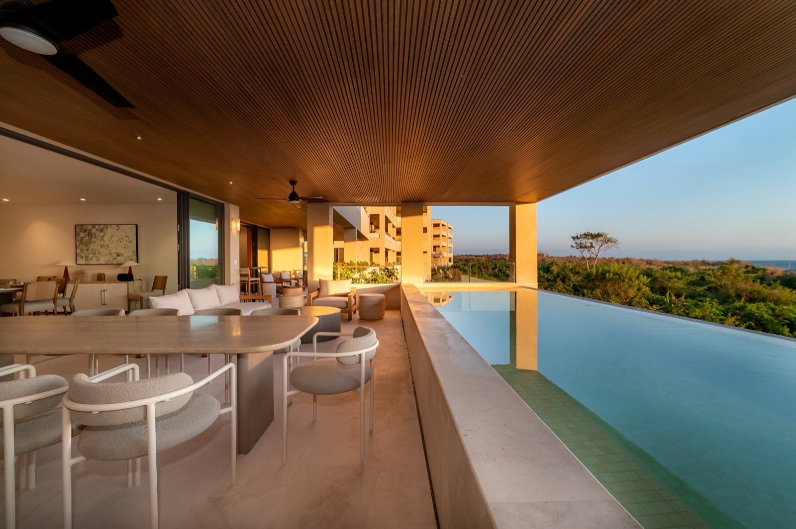 Surf Residences 312 long pool beside a covered dining and living terrace — Punta Mita Nayarit, Mexico