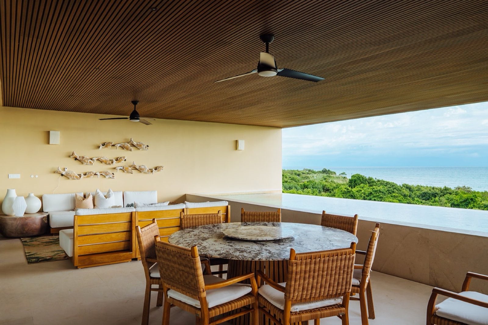 Condo Surf Residences 321 covered terrace with round dining table and built-in bench — Punta Mita Nayarit, Mexico