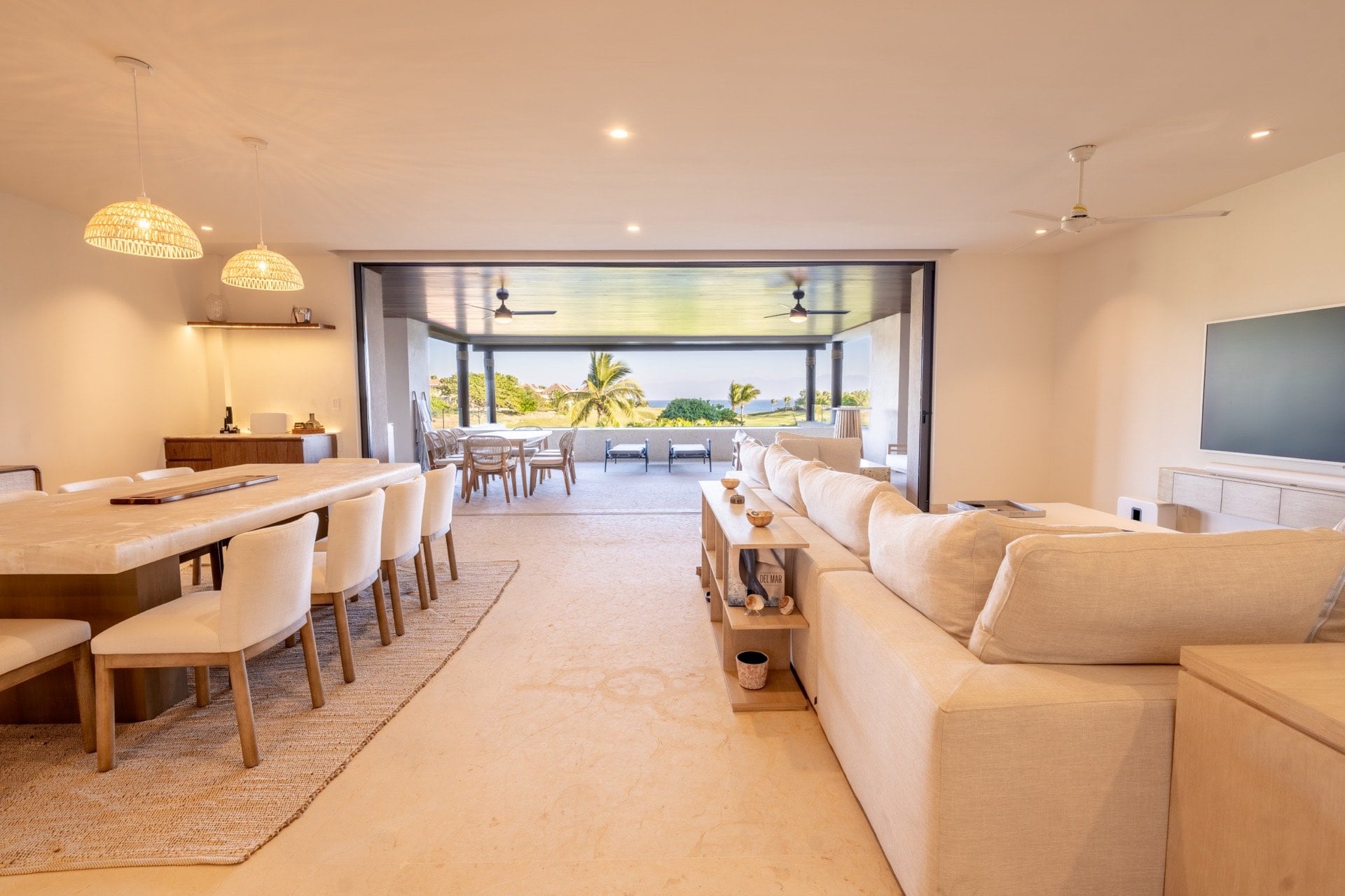 Condo Tau 612 open dining and living room with hanging lights — Punta Mita Nayarit, Mexico