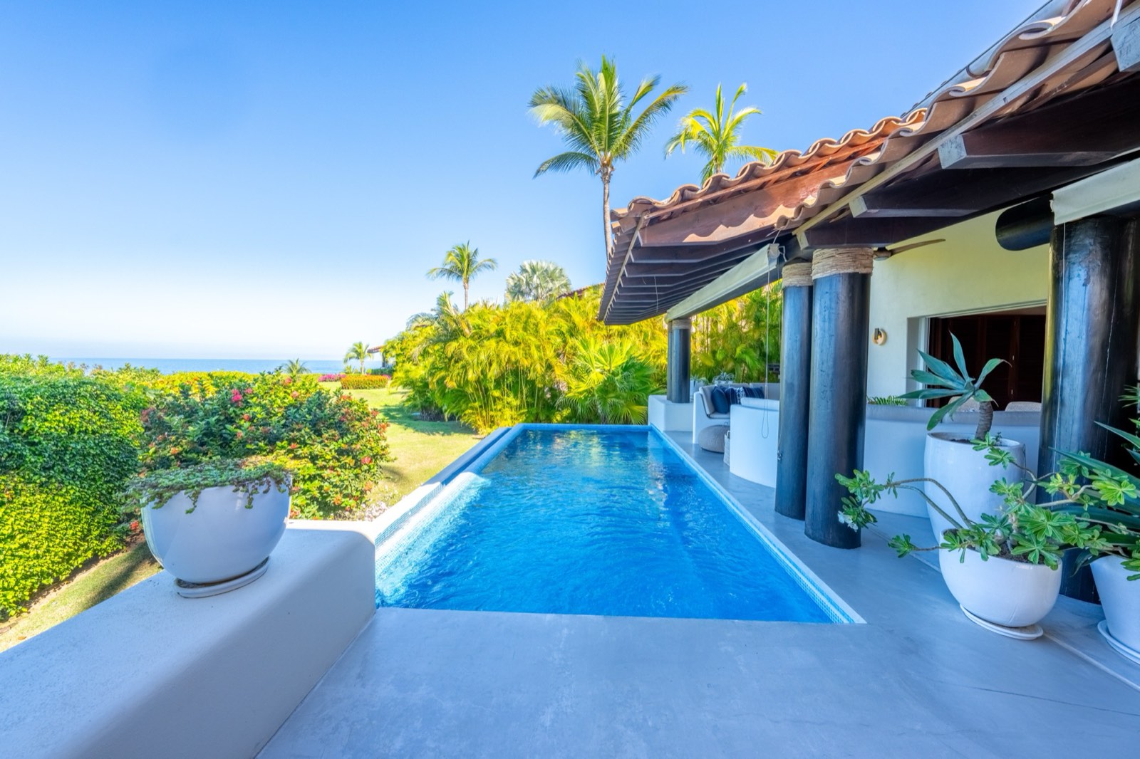 Four Seasons Villa 2037 pool beside a covered terrace with the ocean beyond — Punta Mita Nayarit, Mexico