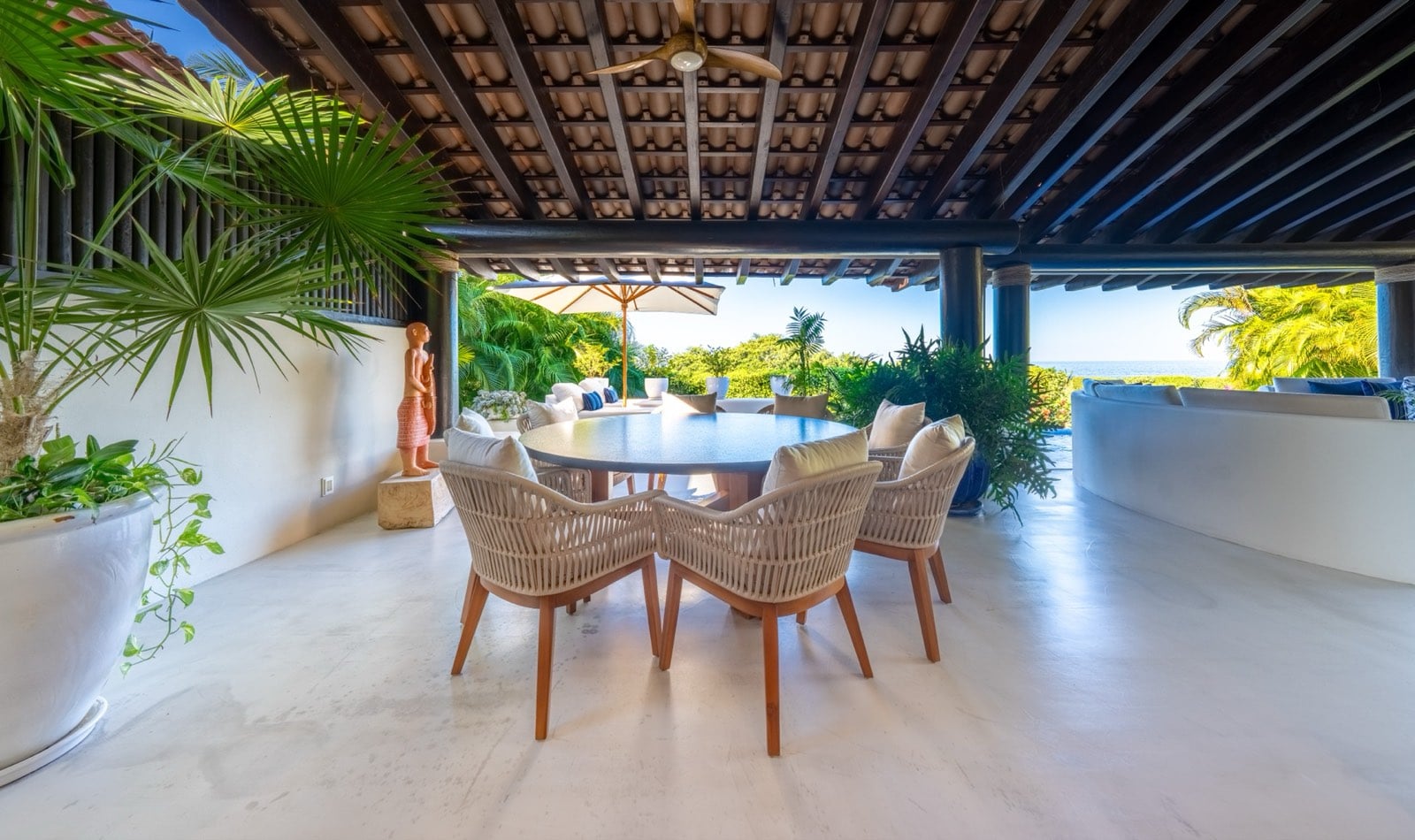 Four Seasons Villa 2037 covered terrace dining table overlooking the garden — Punta Mita Nayarit, Mexico
