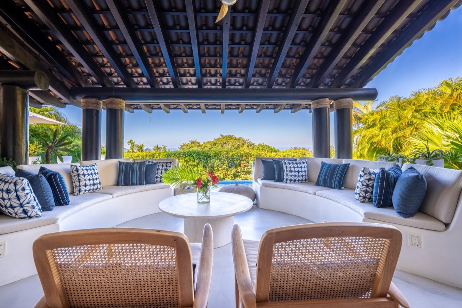 Four Seasons Villa 2037 covered terrace with curved seating and a round table — Punta Mita Nayarit, Mexico