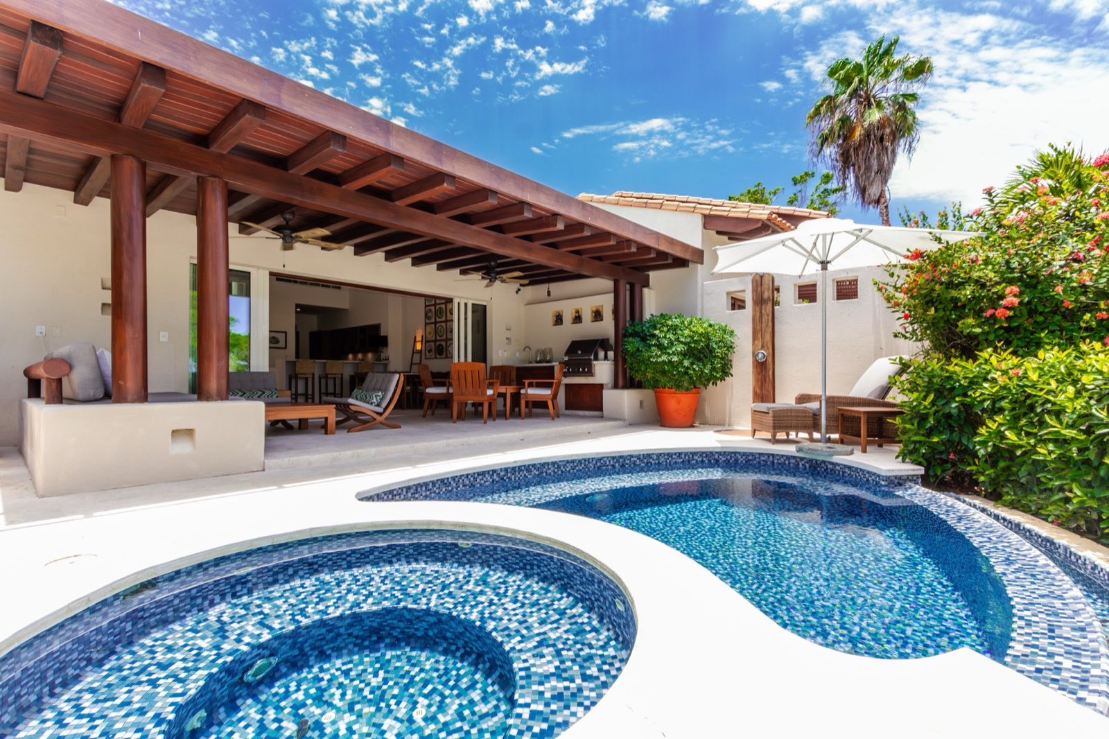 Villa Cazadores curved pool and round basin with blue mosaic tiles — Punta Mita Nayarit, Mexico