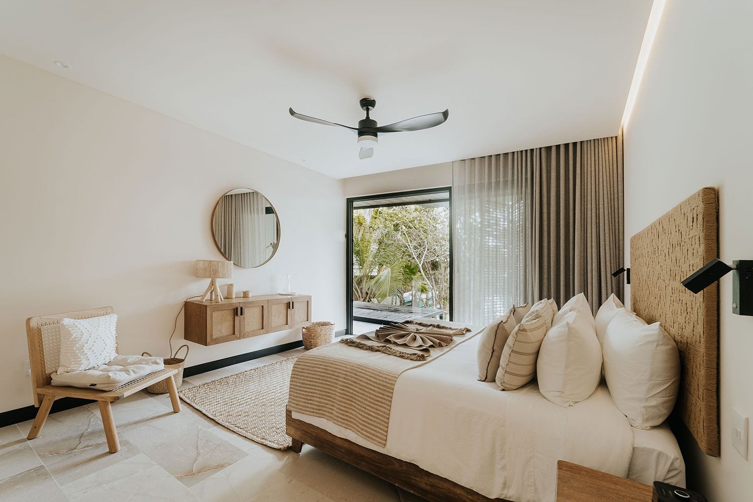 Azumaya Beach House neutral king bedroom with woven headboard and garden view — Soliman Bay Tulum