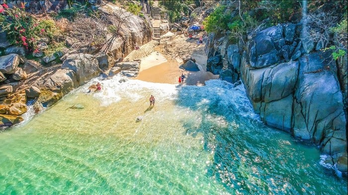 Playa Colomitos hidden beach tiny turquoise cove between jungle cliffs near Puerto Vallarta