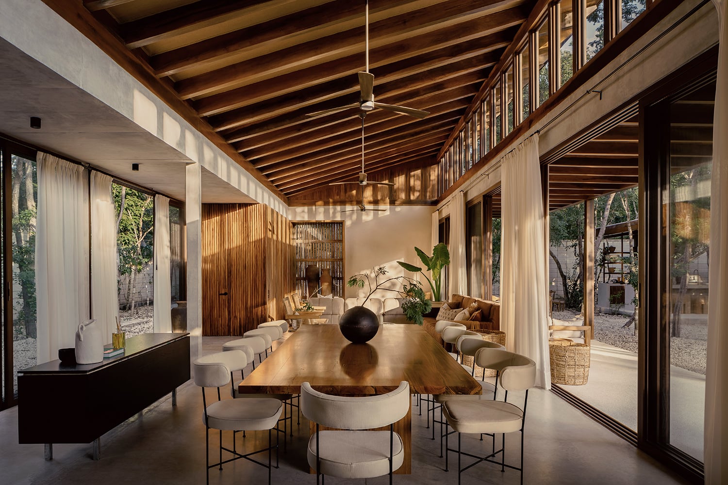 Casa Tropical live-edge dining table with seating for ten guests — Region 15 Tulum