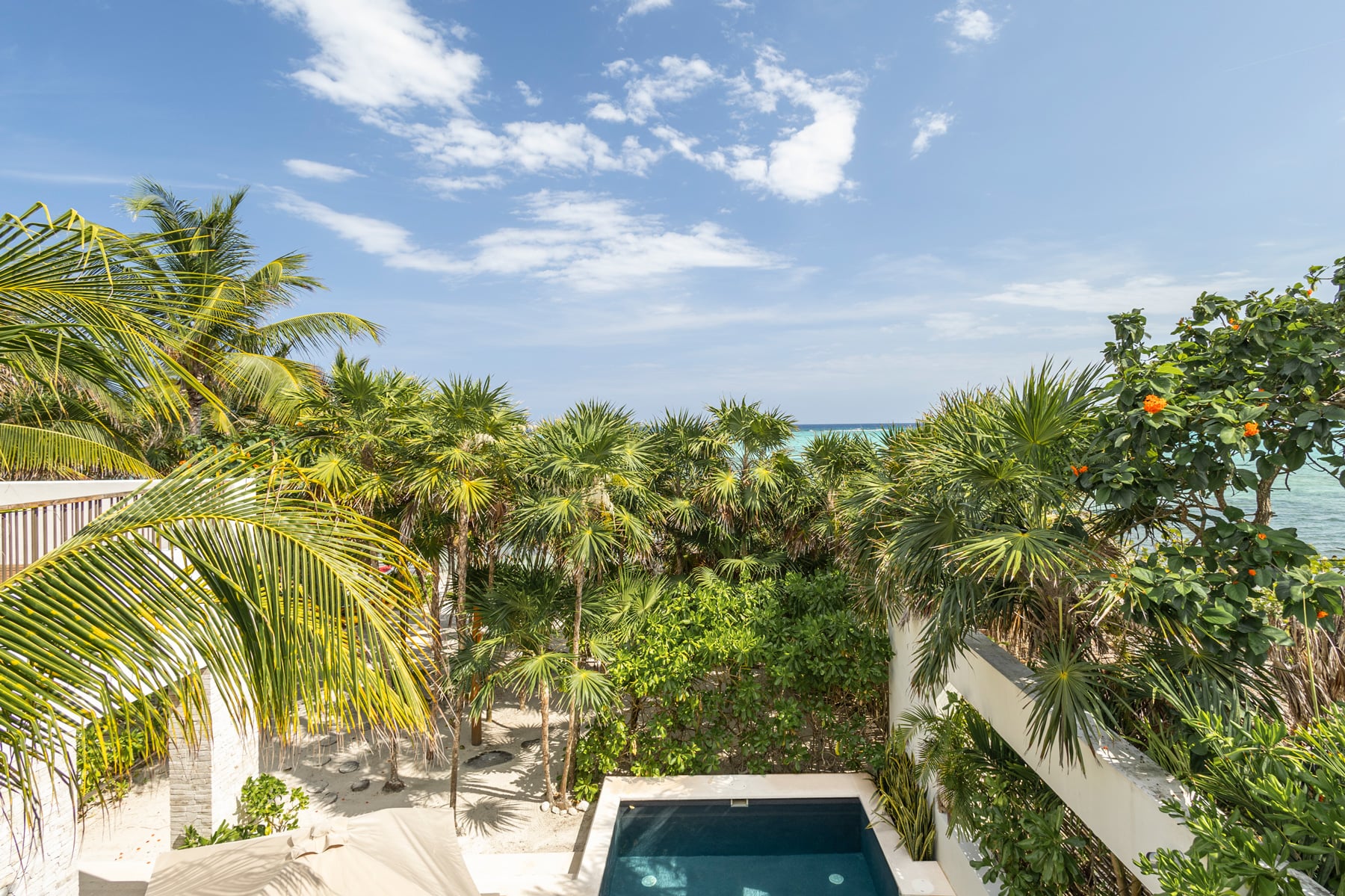 Casa Xixim palm canopy above a small courtyard pool — Tulum, Mexico
