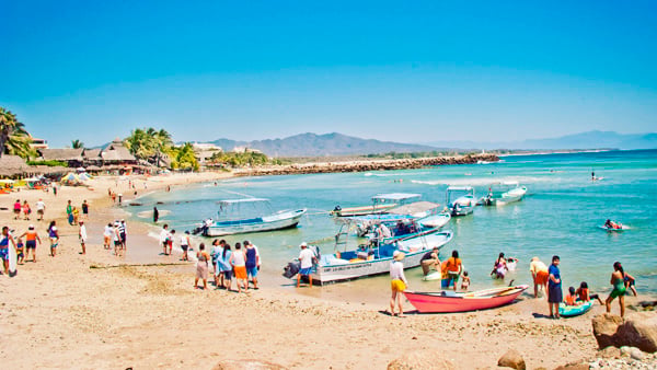 Fishing pangas and charter boats at El Anclote pier Punta Mita