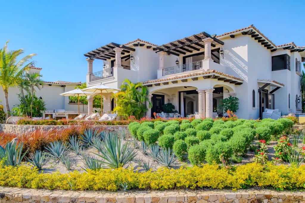 Villa Palmaritos 6 the full facade above clipped hedging and agaves — Los Cabos, Mexico