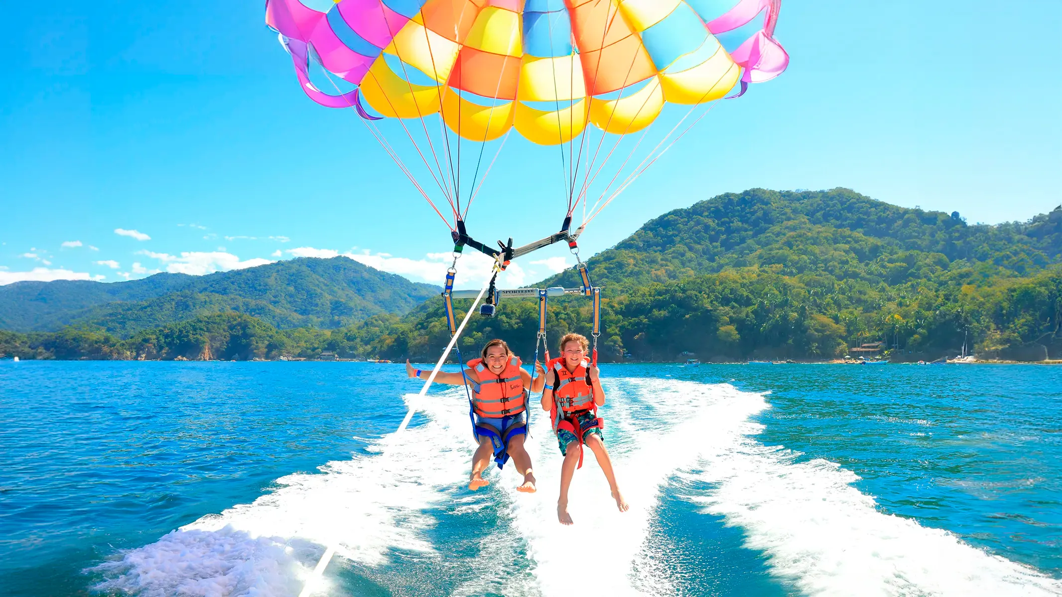 Parasailing adventure soaring 150 feet above Banderas Bay Puerto Vallarta with panoramic coastline views
