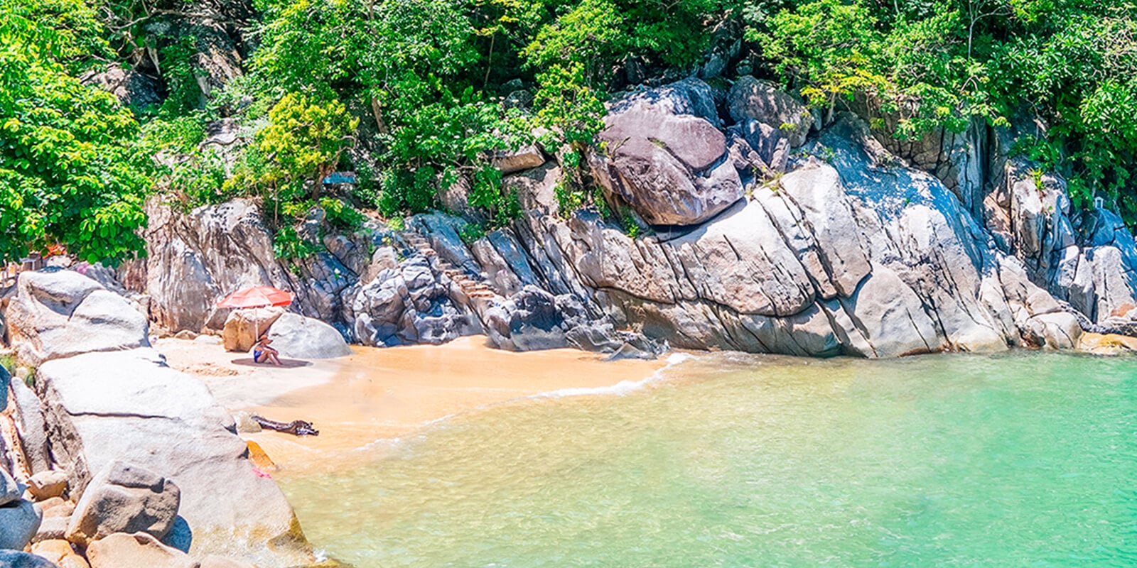 Playa Colomitos smallest beach in Mexico turquoise cove between jungle-covered cliffs south of Puerto Vallarta