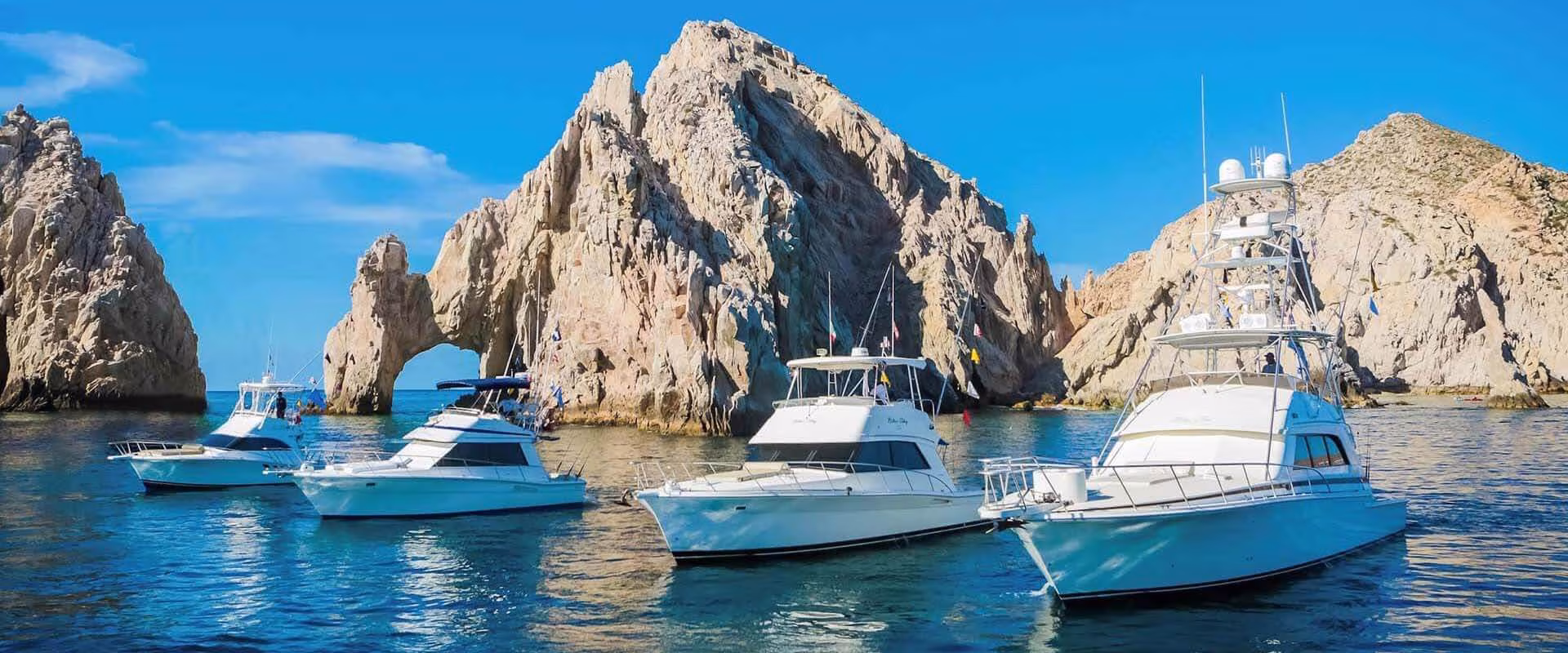 Sport fishing charter boat heading out from Cabo San Lucas marina for deep sea fishing