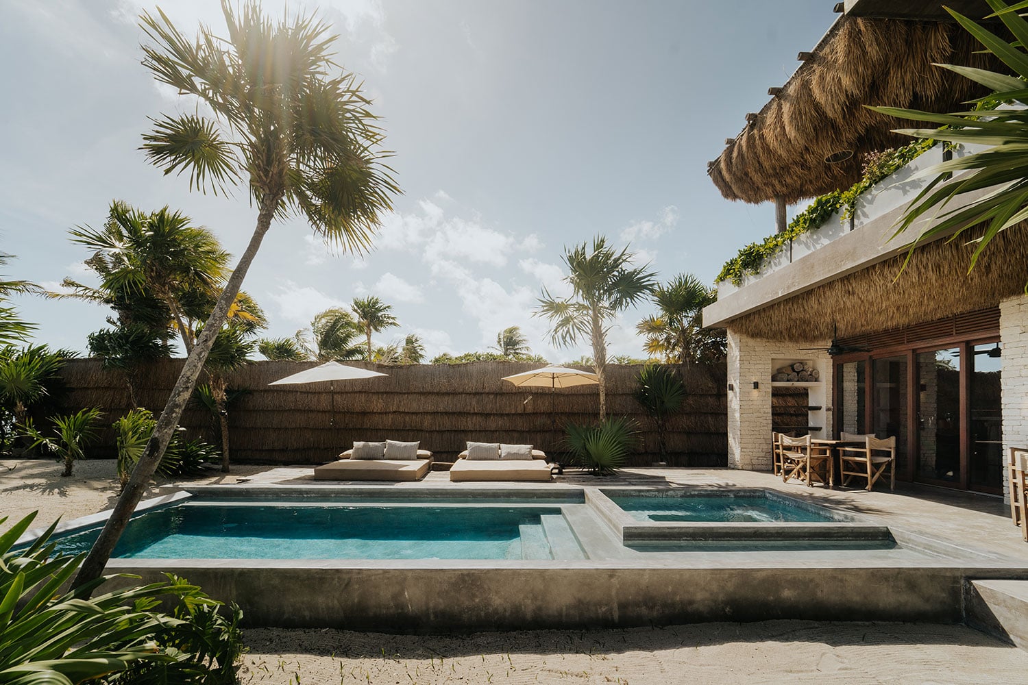 Villa Moloch pool and jacuzzi with daybed loungers and sun umbrellas — Soliman Bay Tulum