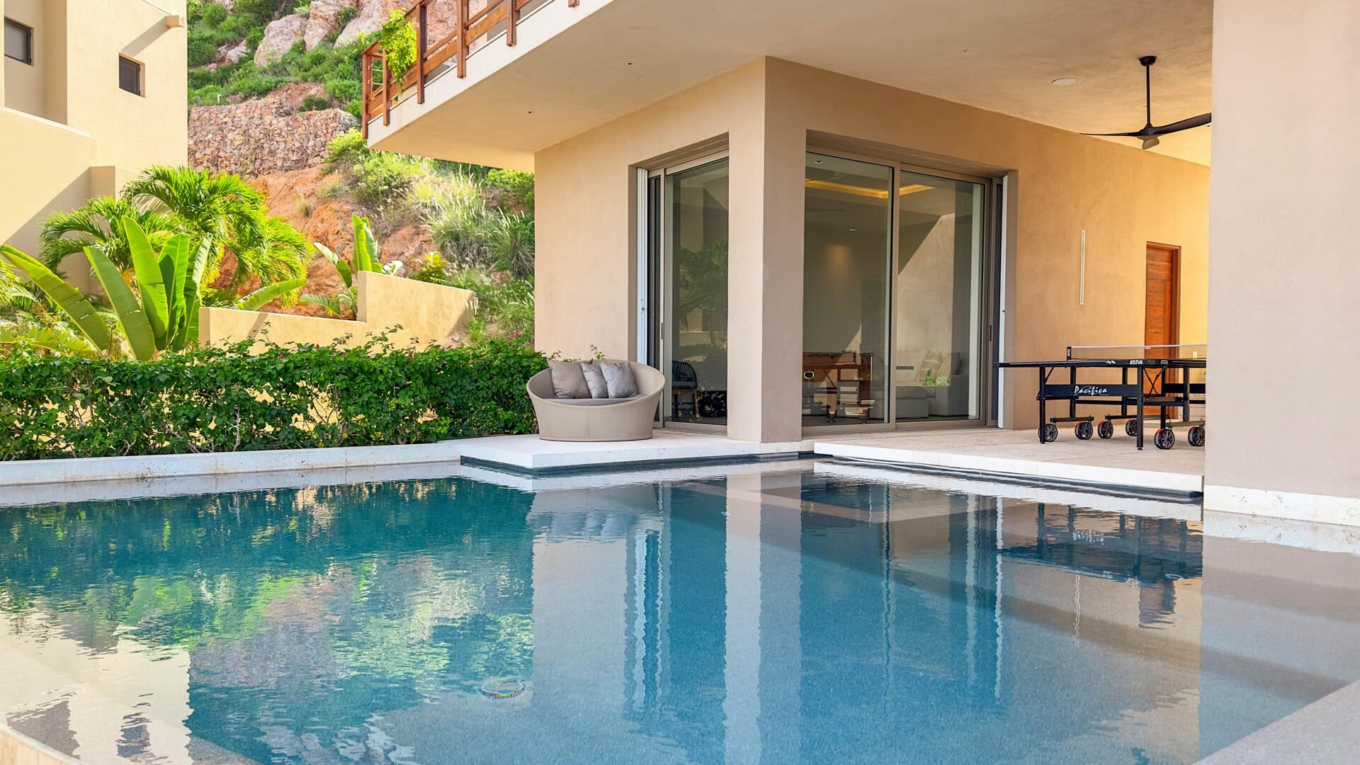 Villa Solara pool and covered patio with sliding glass doors — Los Cabos, Mexico
