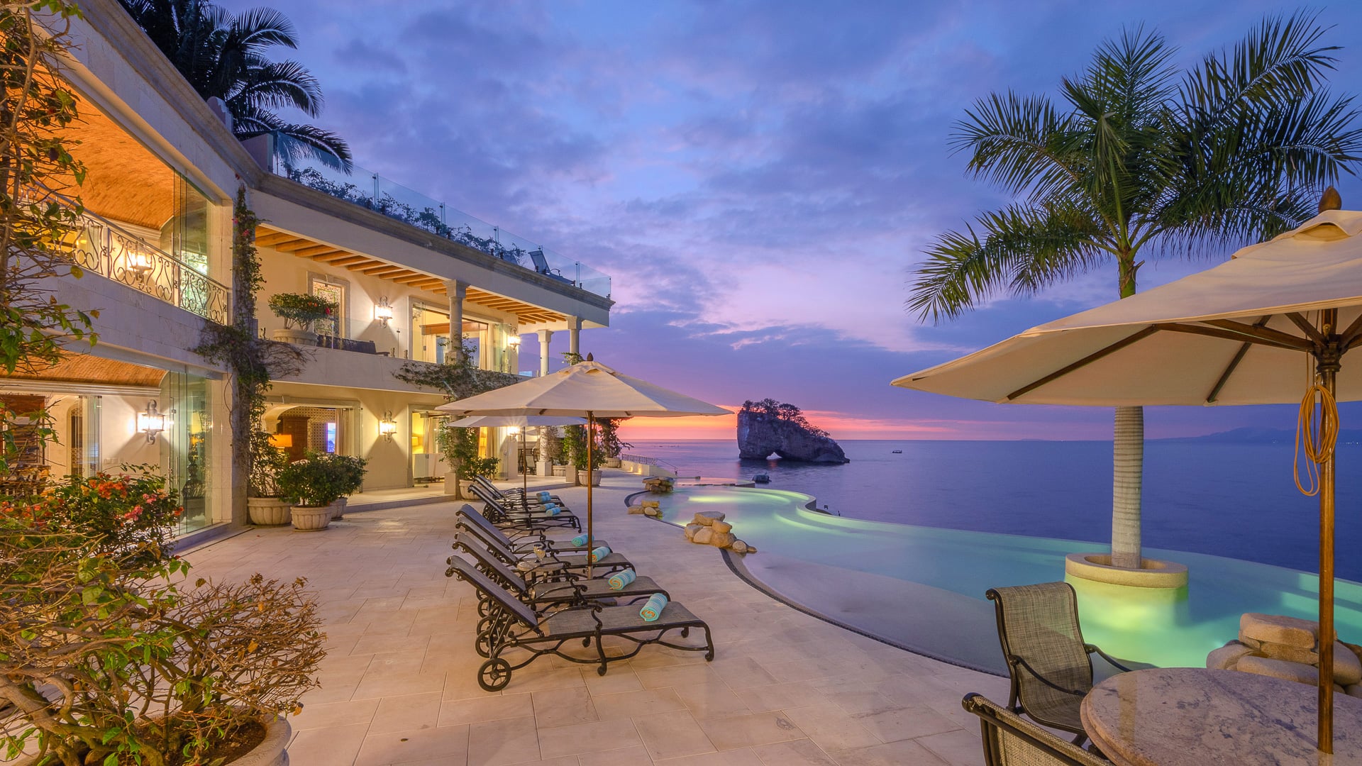 Casa Michael pool terrace and facade beneath a twilight sky — Puerto Vallarta, Mexico