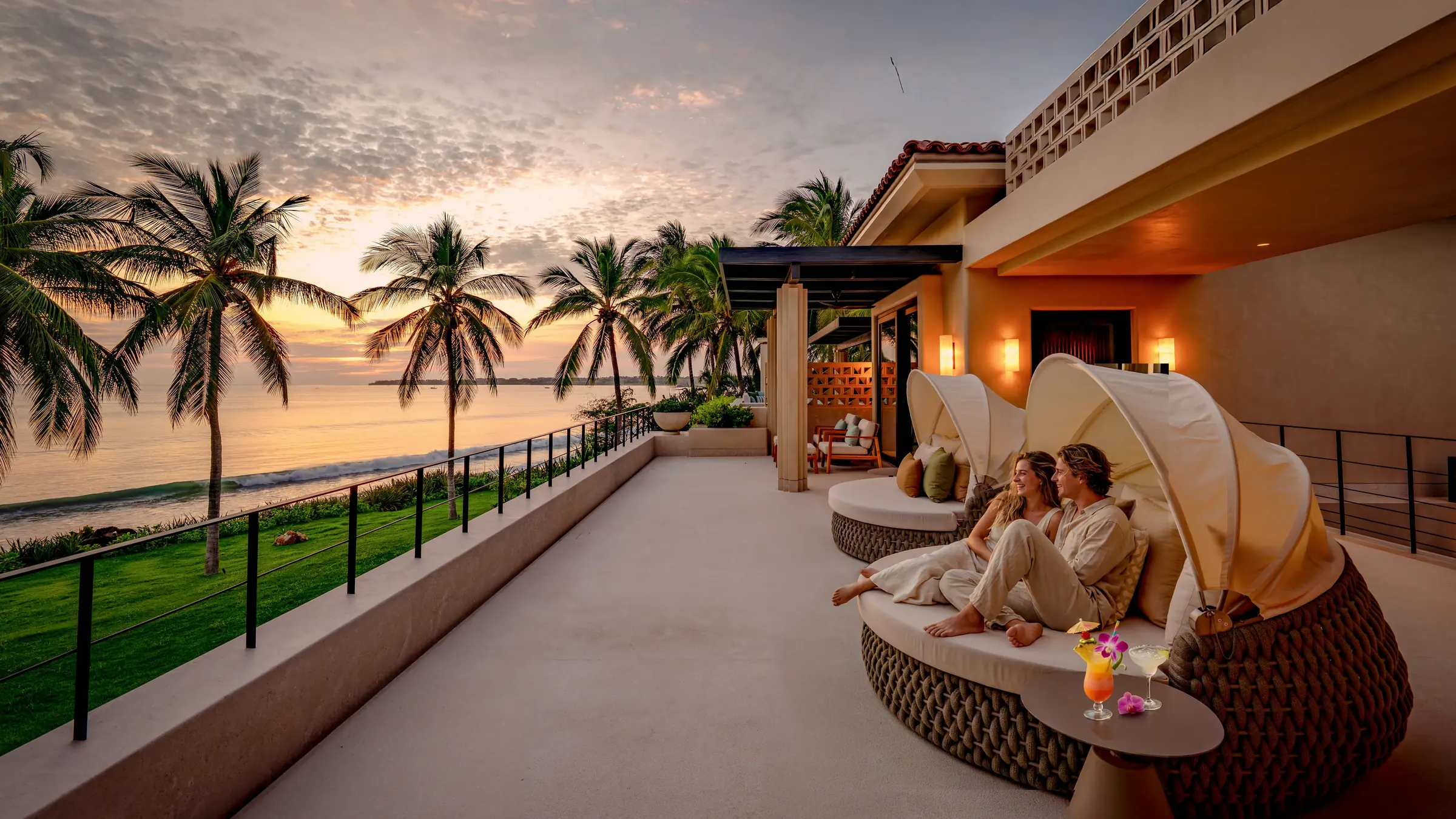 Casa Happy Paws two women seated on an upper terrace above the ocean — Punta Mita Nayarit, Mexico