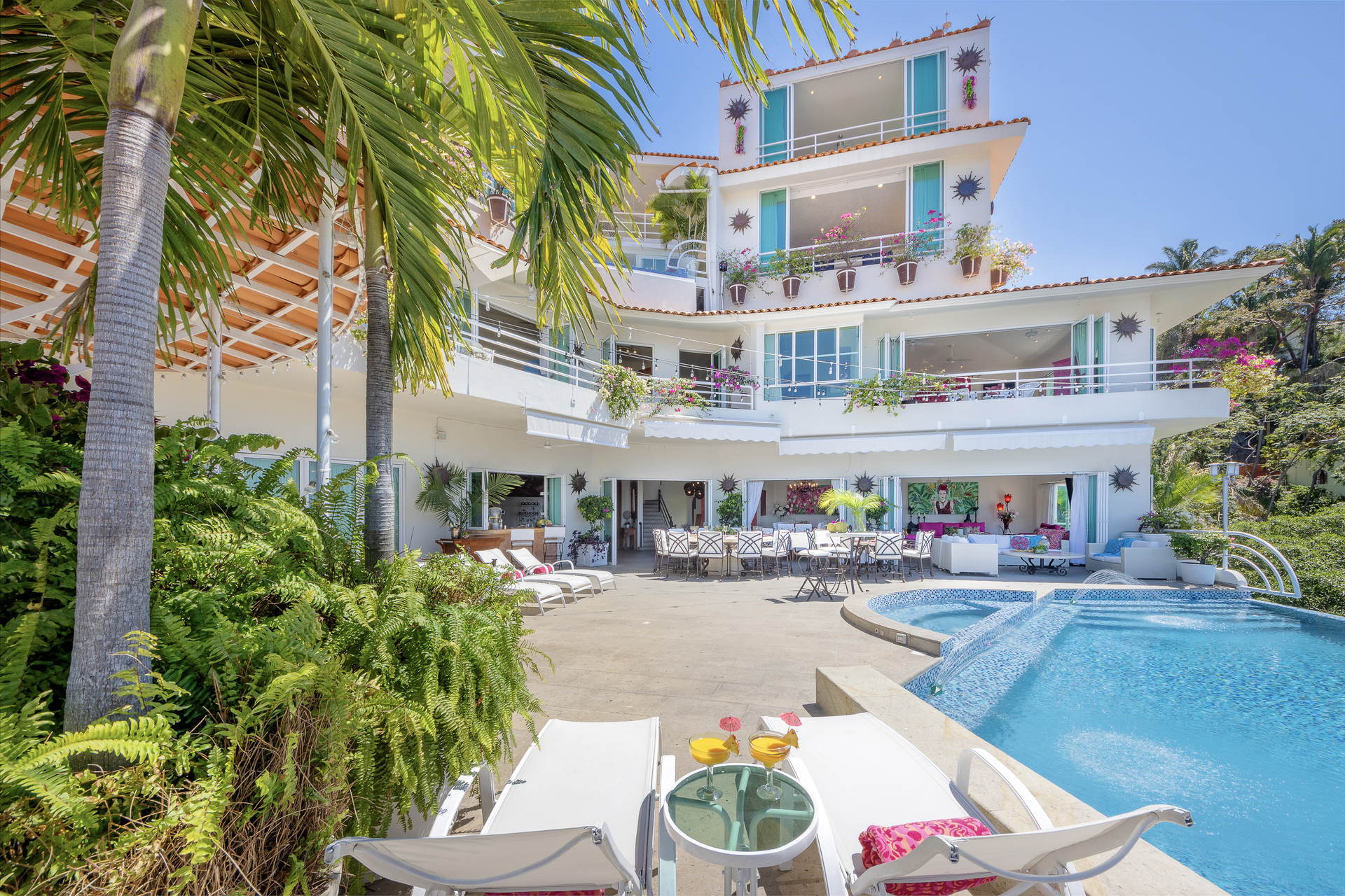 Villa Yvonneka white multi-level exterior with pool and loungers — Puerto Vallarta, Mexico